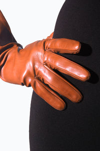Fingers details of Medium length leather gloves by Ines Gloves in brown colour.