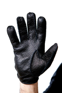 Palm of Hand wearing Black Peccary Leather Gloves for man by Ines Gloves