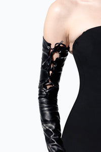 Arm wearing longest leather black gloves with corset closing by Ines