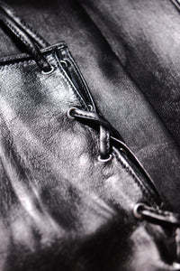 Detail of long leather gloves with corset closing by Ines